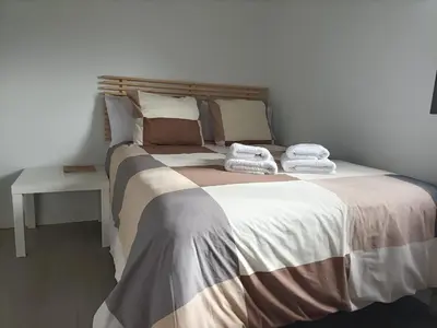 Cama o camas de una habitación en Alojamiento Las Palmeras