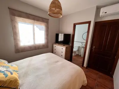 Cama o camas de una habitación en Casa con piscina en Málaga