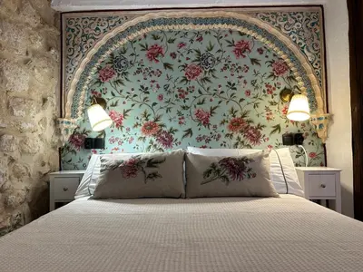 Cama o camas de una habitación en Las casillas de la villa BULERÍAS