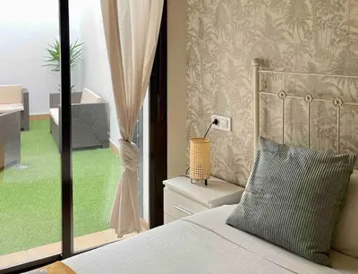 Cama o camas de una habitación en Coqueto apartamento en el centro de Sevilla con patio privado
