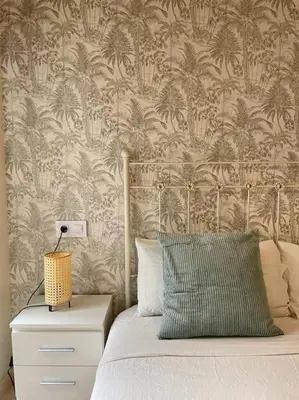 Cama o camas de una habitación en Coqueto apartamento en el centro de Sevilla con patio privado