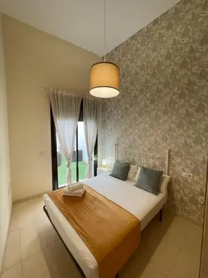 Cama o camas de una habitación en Coqueto apartamento en el centro de Sevilla con patio privado