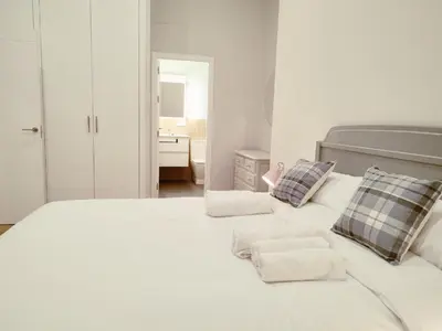 Cama o camas de una habitación en NUEVO RIBERA Arcangel Suite
