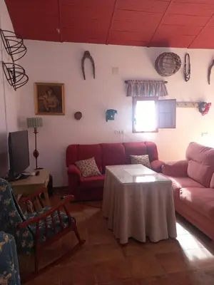 Zona de estar de Casa Rural Camino de los molinos y su establo