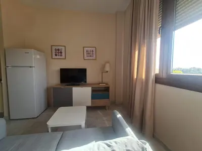 Una televisión o centro de entretenimiento en Lux Abril