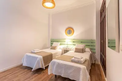 Cama o camas de una habitación en Apartamento Raya - Vacacional Sevilla