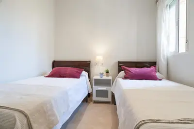 Cama o camas de una habitación en Gran Capitan Boulevard