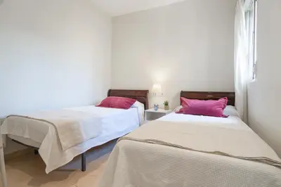 Cama o camas de una habitación en Gran Capitan Boulevard