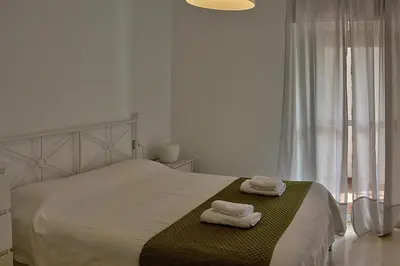 Cama o camas de una habitación en Unika Homes Palacio de Congresos