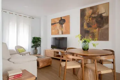 Una televisión o centro de entretenimiento en Magno Apartments González Cuadrado