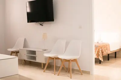 Una televisión o centro de entretenimiento en Apartamentos La Pila del Pato