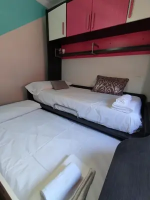 Cama o camas de una habitación en Adosado Centro Urbano 3 Dorm Patio Terraza Wi-fi Puente Genil 1-6 Huésped