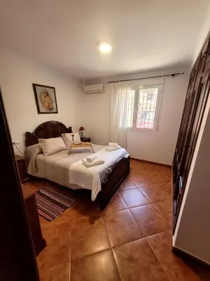 Cama o camas de una habitación en Casa rural Paqui