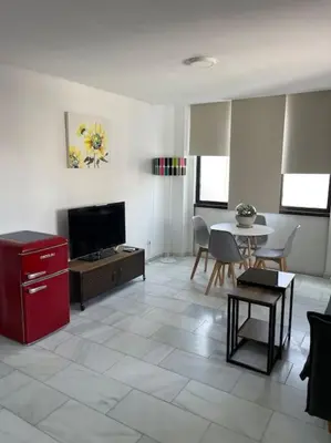 Una televisión o centro de entretenimiento en Apartamento casa Carmen en el centro