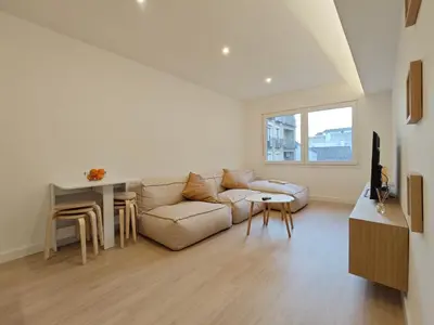 Una televisión o centro de entretenimiento en Apartamento Plaza Pineda