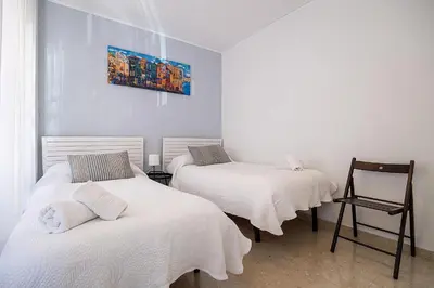 Cama o camas de una habitación en Alcázares Apartment in Historic Center Córdoba