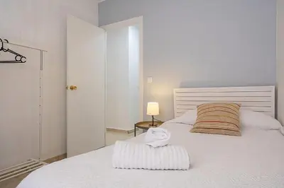 Cama o camas de una habitación en Alcázares Apartment in Historic Center Córdoba