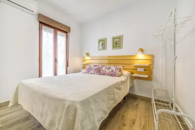 Cama o camas de una habitación en Apartamentos Deanes & Casco histórico
