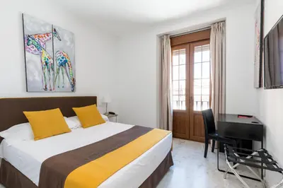 Cama o camas de una habitación en Cool Sevilla Hotel