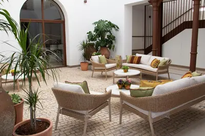 Zona de estar de Puerta de la Ribera Suites