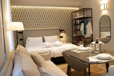 Cama o camas de una habitación en Puerta de la Ribera Suites