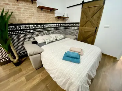 Cama o camas de una habitación en Sevilla Centro con parking