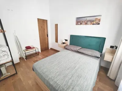 Cama o camas de una habitación en Sevilla Centro con parking