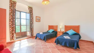 Cama o camas de una habitación en Cortijo San Rafael Constantina by Ruralidays