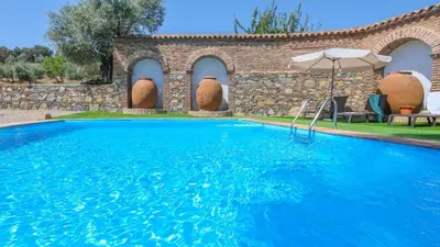 Piscina en o cerca de Cortijo San Rafael Constantina by Ruralidays