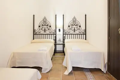 Cama o camas de una habitación en Hostal Palacio del Corregidor