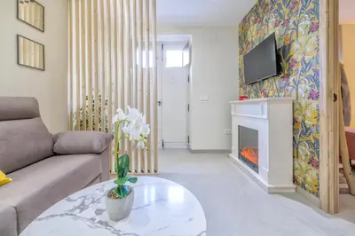 Una televisión o centro de entretenimiento en Aromas de San Pedro