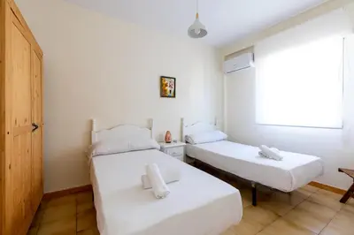 Cama o camas de una habitación en Apartamento Familiar María Auxiliadora