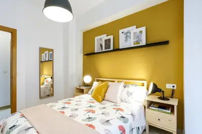 Cama o camas de una habitación en Apartamentos Diaber San Leandro