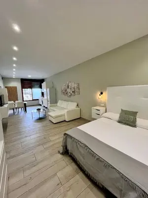 Cama o camas de una habitación en Califa SuitesGP