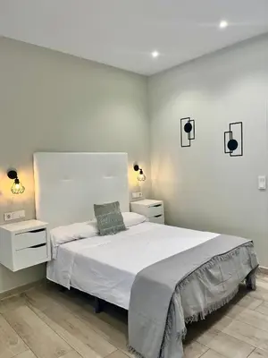 Cama o camas de una habitación en Califa SuitesGP