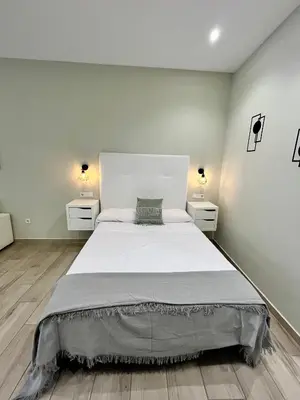 Cama o camas de una habitación en Califa SuitesGP