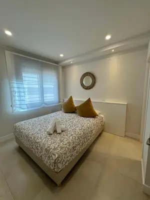 Cama o camas de una habitación en Apartamentos Las Acacias