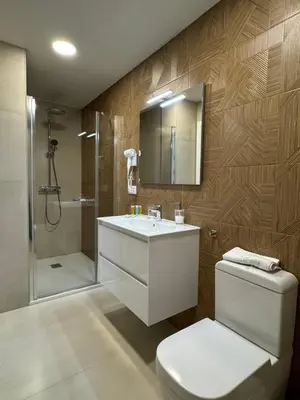 Un baño de Apartamentos Las Acacias