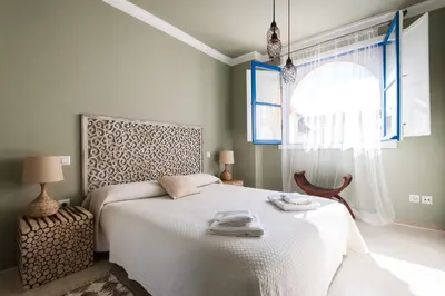 Cama o camas de una habitación en DREAM Sevilla Apartment, charming in the center