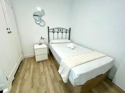 Cama o camas de una habitación en Geysotur Suite Santa Rosa