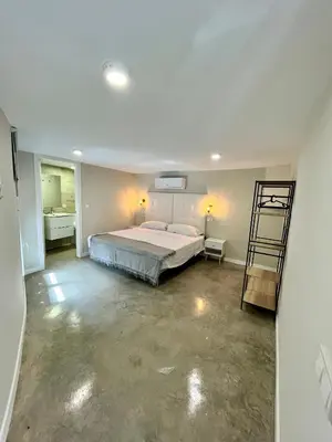 Cama o camas de una habitación en Ribera Suites GP