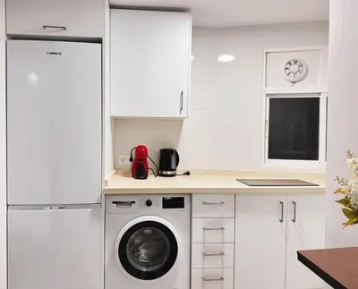Una cocina o zona de cocina en A un paso de la Basilica Macarena WIFI