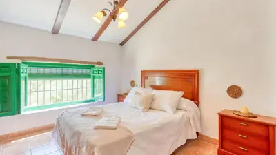 Cama o camas de una habitación en Cortijo San León Fuente de Piedra by Ruralidays