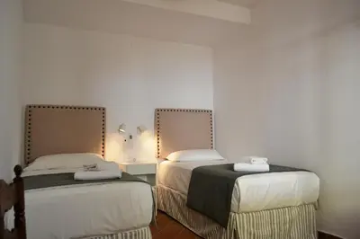 Cama o camas de una habitación en SunShine Paseo de la Victoria