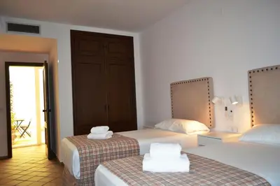 Cama o camas de una habitación en SunShine Paseo de la Victoria