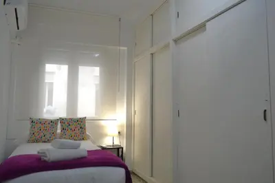 Cama o camas de una habitación en Sunshine Menendez Pelayo