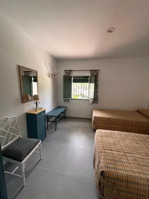 Cama o camas de una habitación en El Cortijo