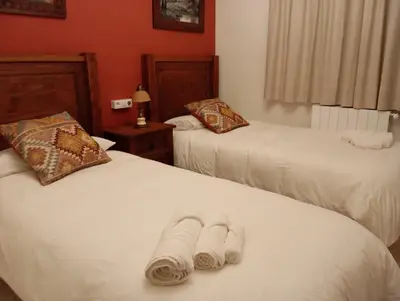 Cama o camas de una habitación en Casa Rural Río Frío