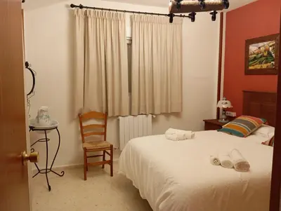 Cama o camas de una habitación en Casa Rural Río Frío