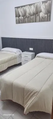 Cama o camas de una habitación en Hostal Las rejas
